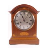 A late Georgian style mahogany striking bracket clock with inlaid decoration,