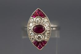 A white metal dress ring. Set with an oval faceted cut ruby to centre.