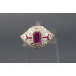 A white metal dress ring set with a rectangular cut pink sapphire of approximately 0.60 carats.