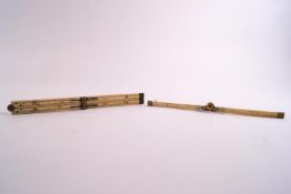 Two 19th century ivory & brass mounted rulers, one in four sections, 11 inches long,