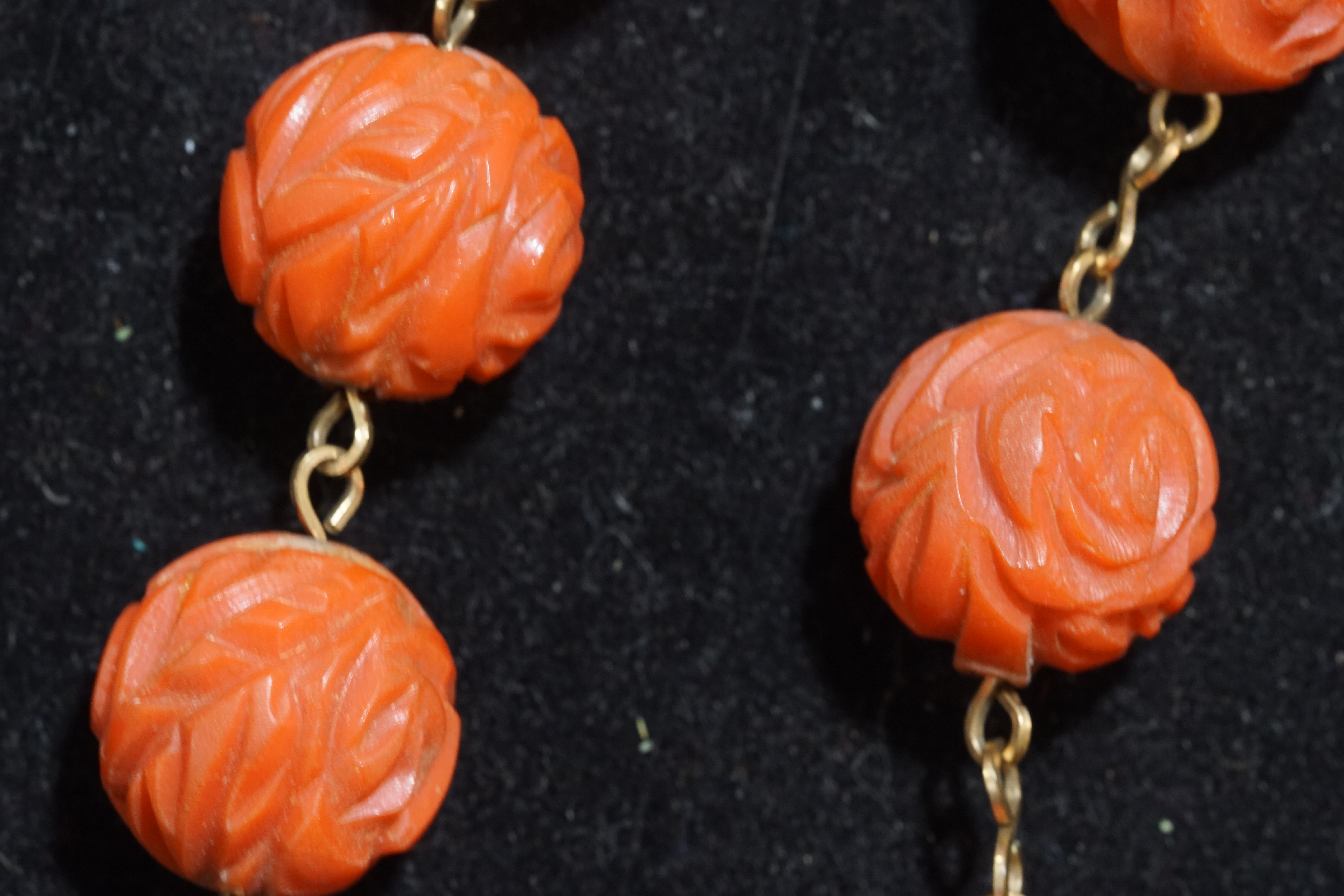 A collection of coral necklaces to include a large carved beaded necklace, - Image 3 of 5