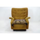 A Parker Knoll recliner chair, upholstered in gold corded fabric with a deep buttoned back,