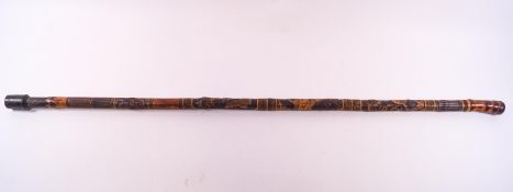 A Japanese bamboo walking stick carved with panels of birdlife, a Geisha and butterflies.92 cm long.