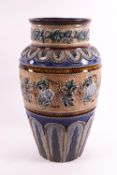 A Royal Doulton stoneware vase, decorated by Emily Stomer with a floral band and leaf panels,