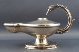 A table cigar lighter in the form of a Roman oil lamp,