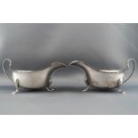 A pair of small silver sauce boats,