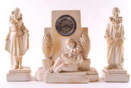 A 1930's composition garniture set of a clock with a pierrot playing an accordion 21cm high and two