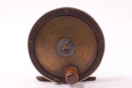 A brass composite fishing reel, stamp marked 'The Fly Fisher's' S E J Winch Regr,