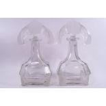 A pair of Art deco Lalique style cut and acid etched glass spirit decanters,