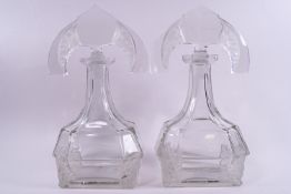 A pair of Art deco Lalique style cut and acid etched glass spirit decanters,