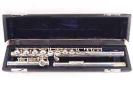 A silver plated three piece flute (cased)