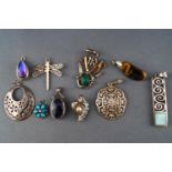A collection of ten silver pendants of variable designs. Marked or tested as Sterling silver 925.