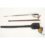 A George Vth issue Officer's Dress Sword with brown leather scabbard and metal hilt,