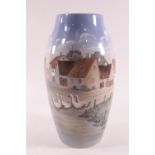 A Bing and Grondahl tall cylinder vase, decorated with a Danish village scene, No 551-6243,