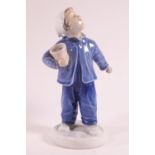 A Bing and Grondahl figure of a boy carrying a pot,