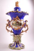 An early 19th Century Coalport style blue ground Campana form two handled urn,