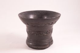 An 18th century style heavy bronze mortar of inverted bell form