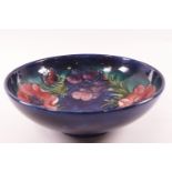 A Moorcroft bowl Anemone pattern pottery bowl, impressed factory marks and signature,