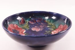 A Moorcroft bowl Anemone pattern pottery bowl, impressed factory marks and signature,