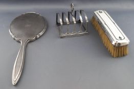 A silver four slice toast rack,