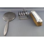 A silver four slice toast rack,