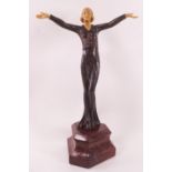 An Art deco Pretssi Chiparus style metal and composition figure of a lady dancer