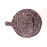 An 18th century style lead fire insurance wall plaque, the centre cast with a coat of arms,
