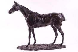 A finely cast metal study of a racehorse,