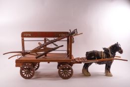 A miniature coal cart, a hay cart and a plough together with a Beswick shire horse,