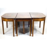 A George III mahogany three unit 'D' end dining table with inlaid satin wood and ebony stringing.