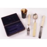 A cased campaign folding spoon and fork,