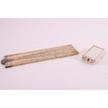 A 19th century ivory scientific ruler in two folding sections, 31cm long,