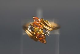 A yellow metal ring set with five marquise cut orange and yellow sapphires
