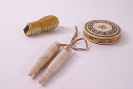 A 19th century ivory mounted pin cushion decorated with acorns and flowers, 5cm diameter,