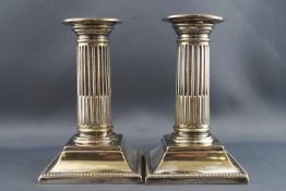 A pair of EPNS low Corinthian column candlesticks,