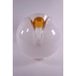 A 1960's Art glass lamp shade/light cover of floral form in opaque glass with an orange centre,
