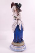 A 19th century Continental hard paste figure of a Gainsborough style lady,
