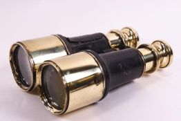 A pair of brass and leather mounted binoculars,