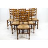 A set of six 18th century style dining chairs with rush seats,