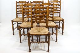 A set of six 18th century style dining chairs with rush seats,