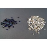 A collection of colourless loose stones to include diamonds,