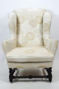 A William and Mary style wing back armchair