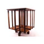 A miniature form oak revolving bookcase,