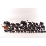 A collection of late 19th century/early 20th century carved hardwood elephants