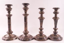 A pair of mid 19th century Sheffield plated candlesticks with bands of floral decoration,