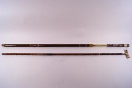 A part cane walking stick with a mother of pearl "T" shaped handle with yellow metal mounts stamped