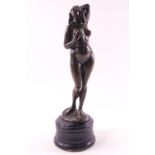 An art deco style bronze of a female figure, signed "Lazio" on turned ebonised base,