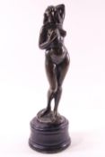 An art deco style bronze of a female figure, signed "Lazio" on turned ebonised base,