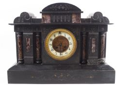 A slate and serpentine Temple clock with four engaged doric columns centred with an ivorine dial