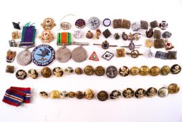 A group of assorted Militaria items including Buttons, Pips, Badges, the 1939 - 45 Medal,